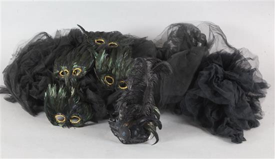 A collection of feather masks, a cape / collar etc.